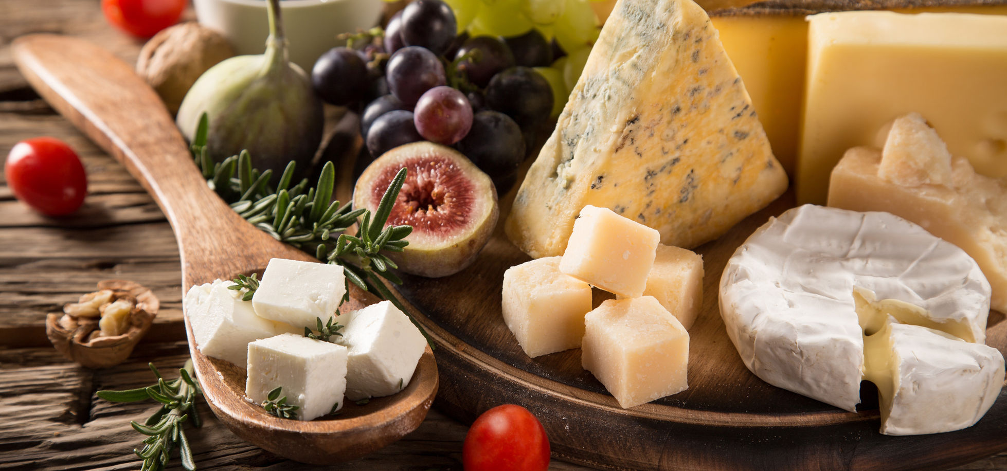A deli board of cheeses, figs, grapes and cured meats at Mayo Brothers
